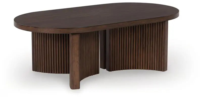 Korestone - Dark Brown - Oval Cocktail Table – Furniture Warehouse Ohio