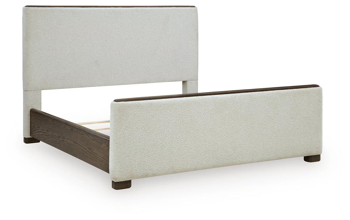 Radkin - California King Upholstered Panel Bed - Burnished Brown