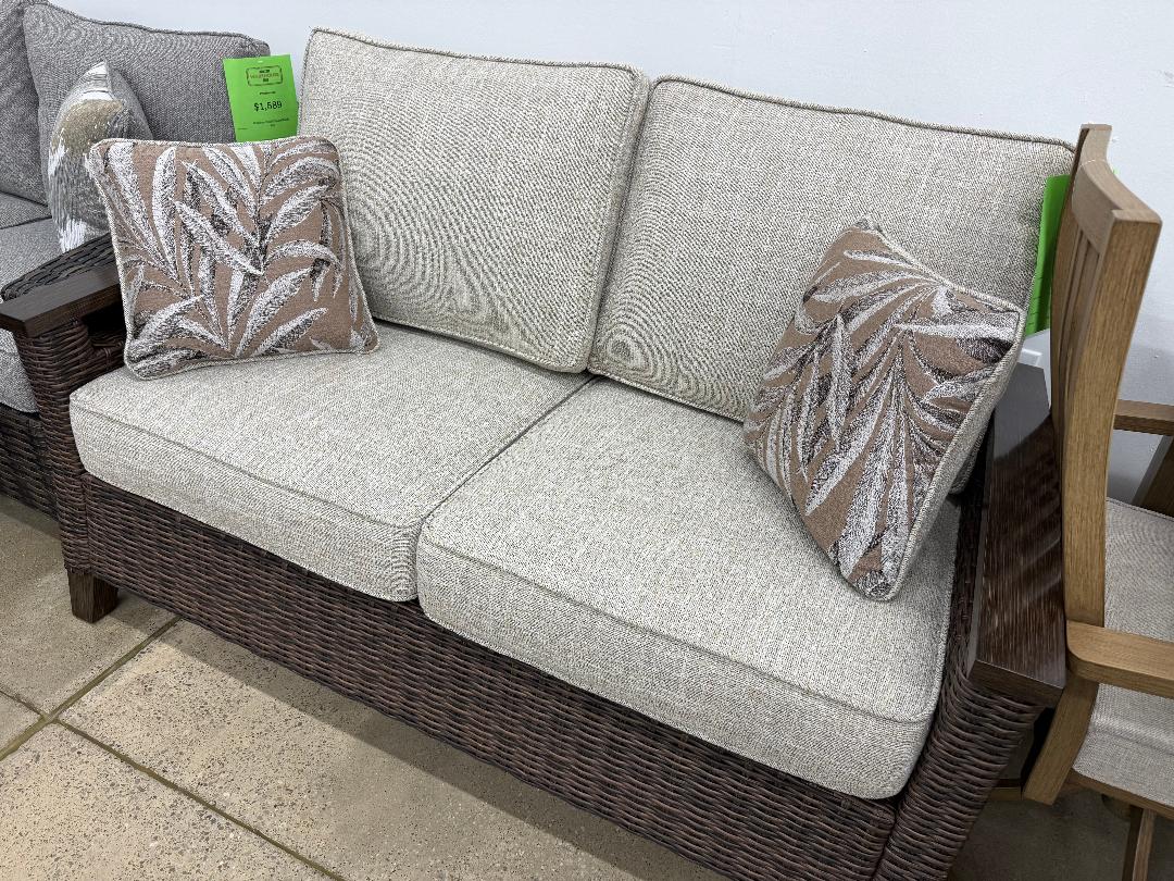 Ashley “Paradise Trail” Outdoor Loveseat with Cushions