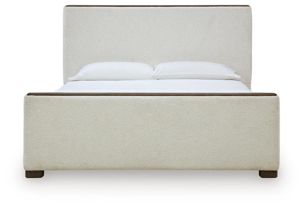Radkin - Queen Upholstered Panel Bed - Burnished Brown