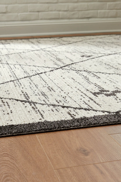 Fenriston - 5' x 8' Rug - Cream / Black