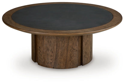 Dontayne - Round Cocktail Table - Warm Brown